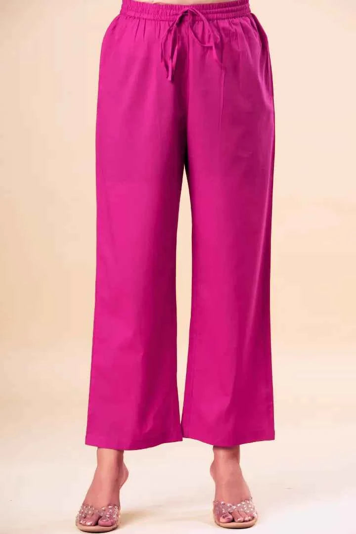 Pink wide-leg pants on a beige background